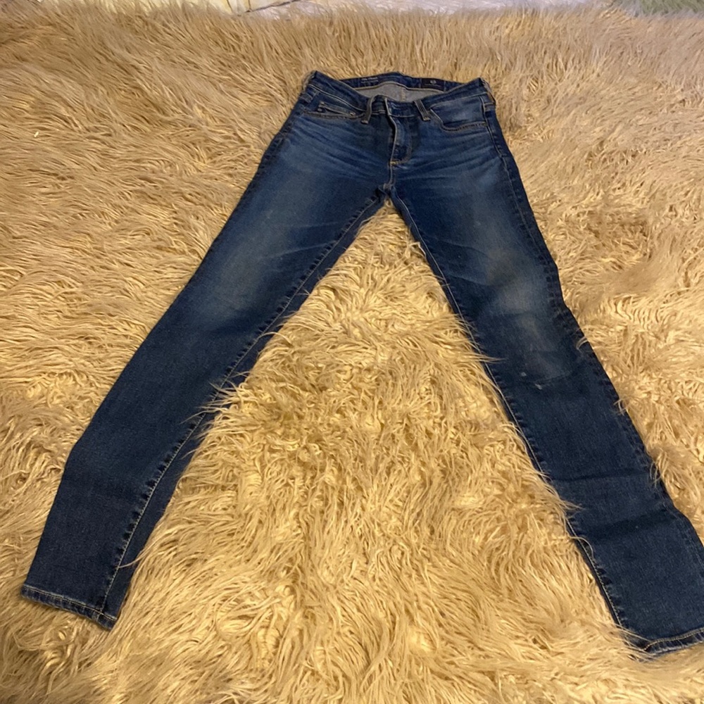 AG skinny straight legged jeans size 24 medium wash.
